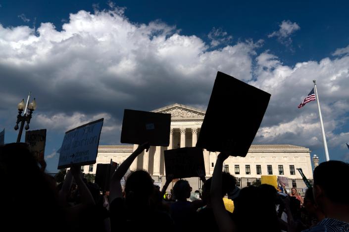 Abortion-rights activists protest outside the Supreme Court in Washington, Saturday, June 25, 2022.