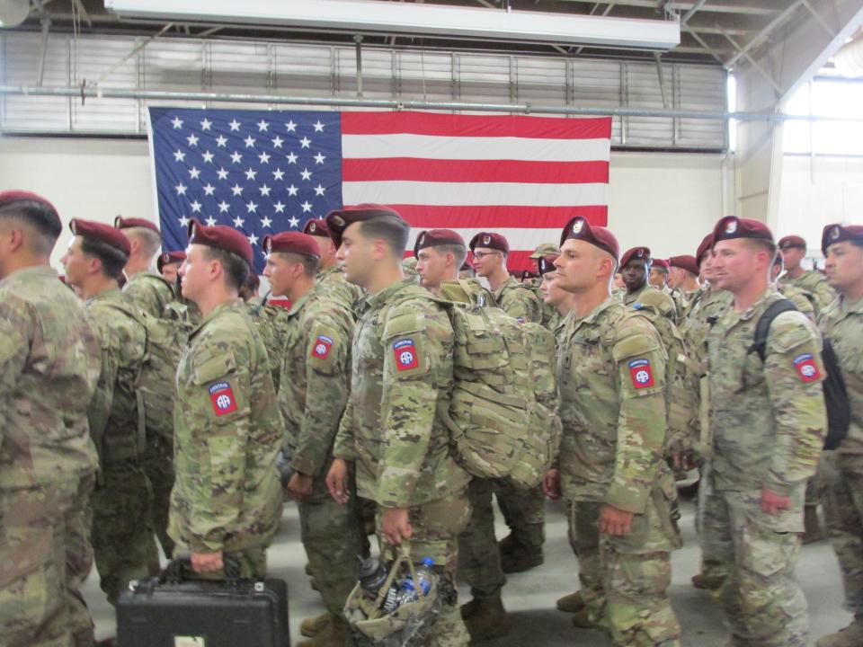 Paratroopers with the 82nd Airborne Divison march into Fort Bragg's Green Ramp on Tuesday, June 28, 2022, after returning home from a deployment to Poland.