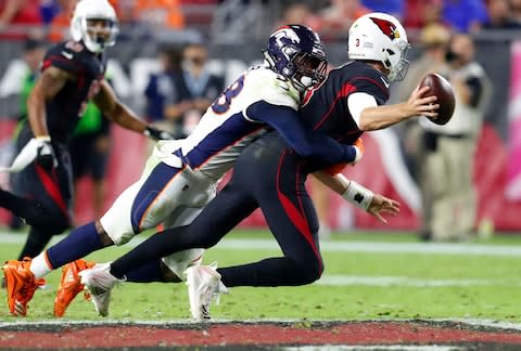 Arizona Cardinals quarterback Josh Rosen, right, is sacked by Denver Broncos linebacker Von Miller (58) during the second half of an NFL football game, in Glendale, Ariz. Miller is in the midst off his best sack streak ever, spanning eight weeks. He's tied Simon Fletcher's franchise record for most sacks - Credit: AP Photo/Ralph Freso