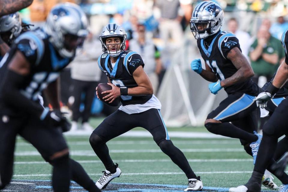 Carolina Panthers quarterback Bryce Young (9) scans the field for a pass during the game agaisnt the Packers at Bank of America Stadium on Sunday, December 24, 2023.