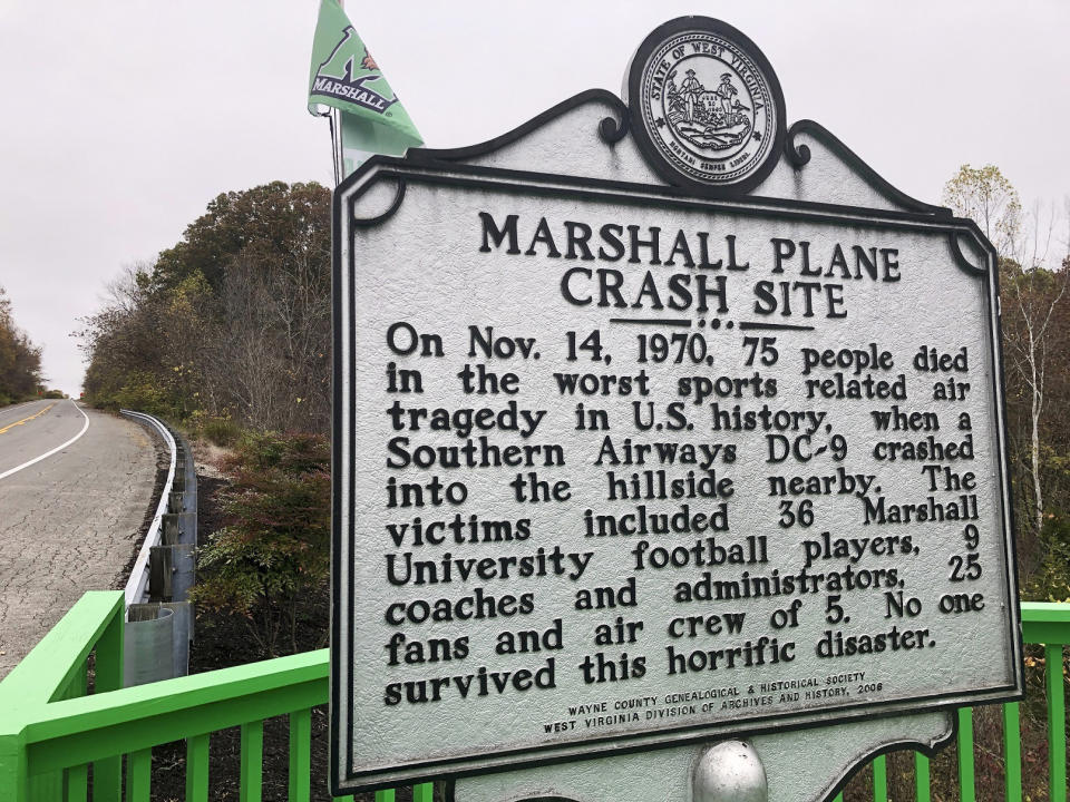 FILE - A memorial plaque is displayed at the site of a 1970 plane crash that killed 75 people, including 36 Marshall football players, on Oct. 24, 2020, near Huntington, W.Va. A bill has won final legislative approval Wednesday, Feb. 15, 2023, in West Virginia, that would establish an annual day of recognition for the worst sports disaster in U.S. history. (AP Photo/John Raby, File)