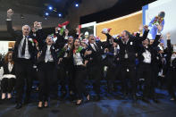 Italy's National Olympic Committee (CONI) president Giovanni Malago, left, and members of Milan-Cortina delegation celebrate after winning the bid to host the 2026 Winter Olympic Games, during the first day of the 134th Session of the International Olympic Committee (IOC), at the SwissTech Convention Centre, in Lausanne, Switzerland, Monday, June 24, 2019. Italy will host the 2026 Olympics in Milan and Cortina d'Ampezzo, taking the Winter Games to the Alpine country for the second time in 20 years. (Philippe Lopez/Pool via AP)