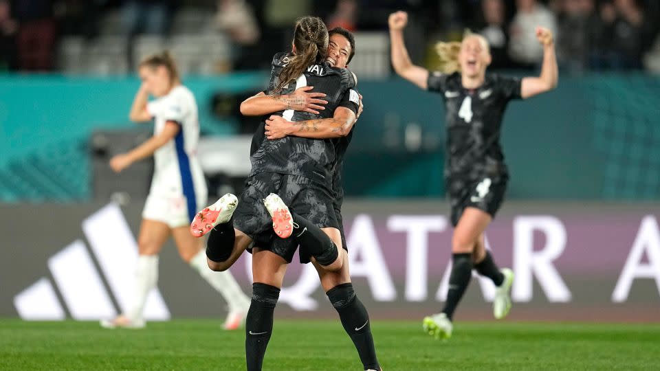 New Zealand's Ria Percival and Ali Riley celebrate their victory. - Abbie Parr/AP