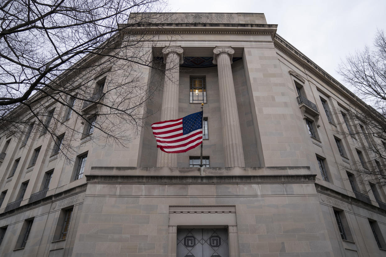 The Department of Justice headquarters with a flag flying.