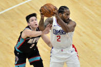 Los Angeles Clippers forward Kawhi Leonard (2) handles the ball against Memphis Grizzlies guard Grayson Allen (3) in the second half of an NBA basketball game Thursday, Feb. 25, 2021, in Memphis, Tenn. (AP Photo/Brandon Dill)