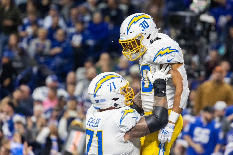 RB Austin Ekeler (30) scored both LA touchdowns Monday night, powering the Chargers back to the playoff.