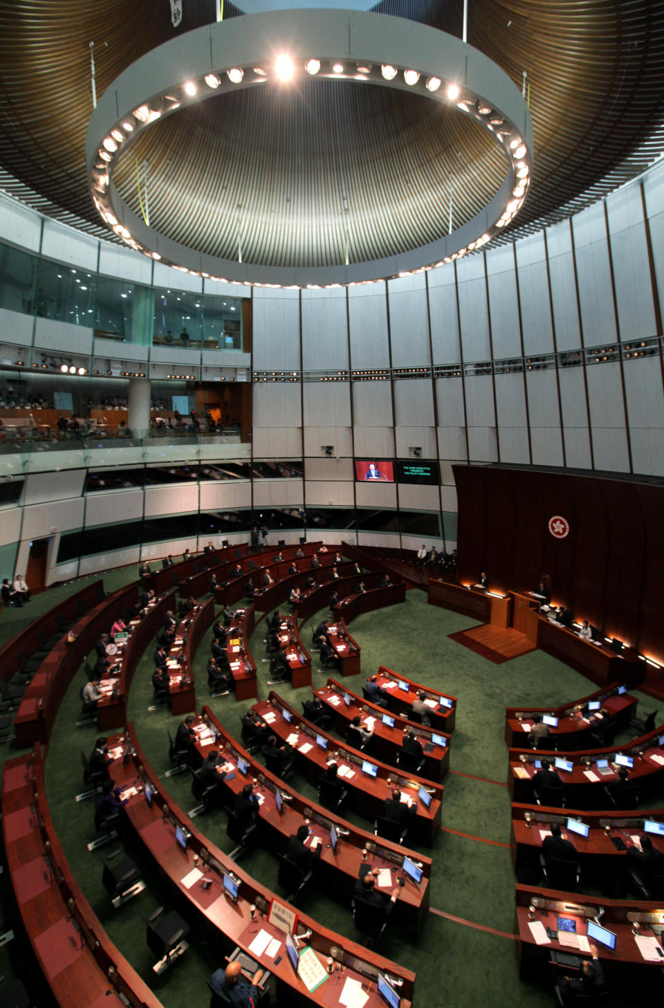 Hong Kong Chief Executive Donald Tsang delivers his last policy speech at the new Legislative Council building in Hong Kong Wednesday, Oct. 12, 2011. Hong Kong will resume a program to sell thousands of affordable apartments a year, the city's leader said Wednesday as he unveiled a key measure in his annual policy speech aimed at cooling public anger over the city's widening rich-poor gap. (AP Photo/Kin Cheung)