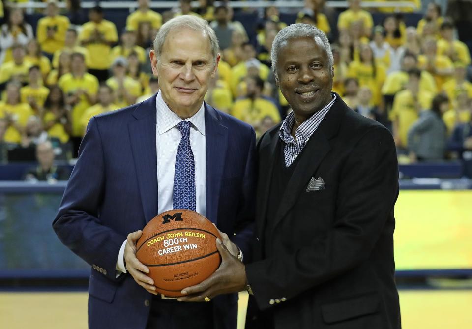 Michigan coach John Beilein is presented a game ball by Greg Harden, celebrating his 800th career win, prior to the start of the game against Holy Cross at Crisler Center, Nov. 10, 2018 in Ann Arbor.