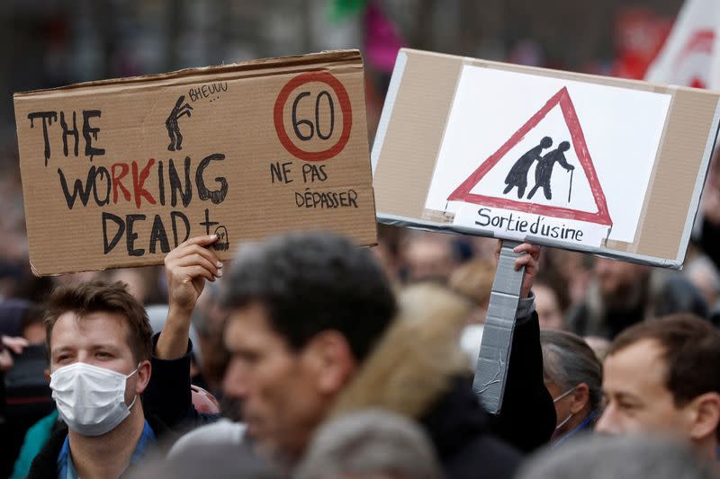 FILE PHOTO: French unions and workers march against pension reforms in Paris