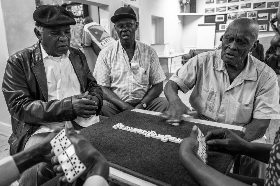 First-generation Caribbean immigrant men play dominoes in Clapham, South London. (Jim Grover)