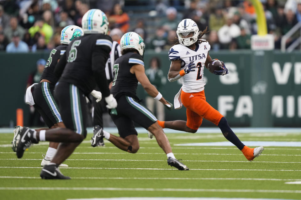 UTSA wide receiver Joshua Cephus (2) carries on a pass reception in the first half of an NCAA college football game against Tulane in New Orleans, Friday, Nov. 24, 2023. (AP Photo/Gerald Herbert)