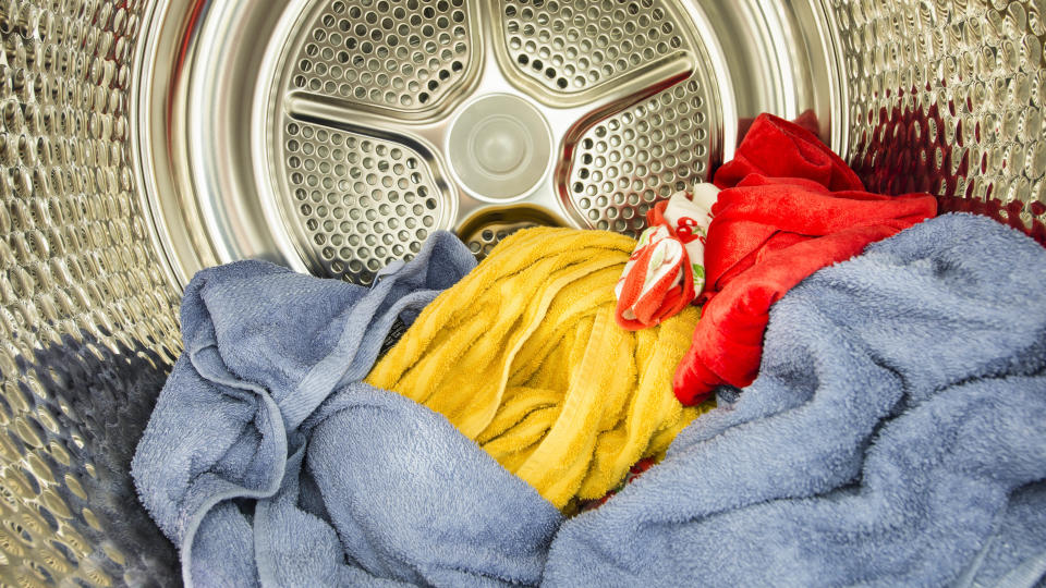 The inside of a clothes dryer filled with laundry