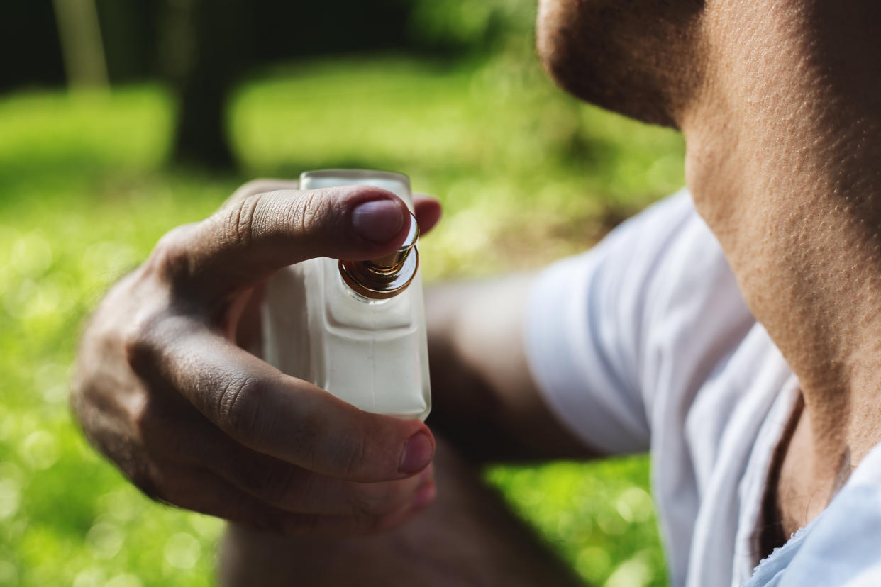 man using perfume