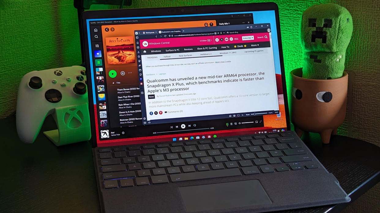  Surface Pro X with Xbox controller displaying Windows Central article. 