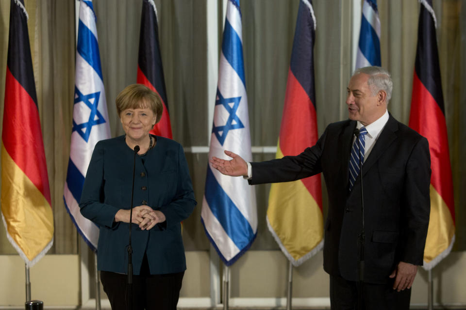 Germany's Chancellor Angela Merkel, left, looks on as Israeli Prime Minister Benjamin Netanyahu gestures during their meeting at the Prime minister's residence in Jerusalem, Monday, Feb. 24, 2014. (AP Photo/Sebastian Scheiner)