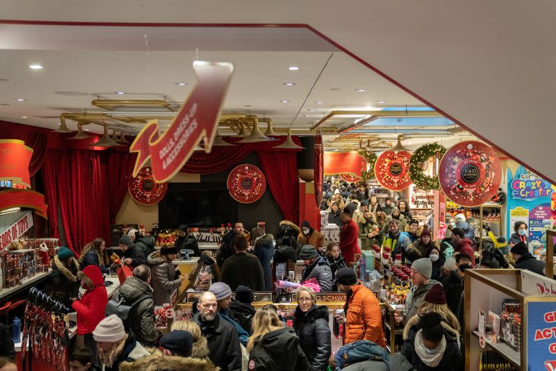 People shop on Christmas Eve in Manhattan