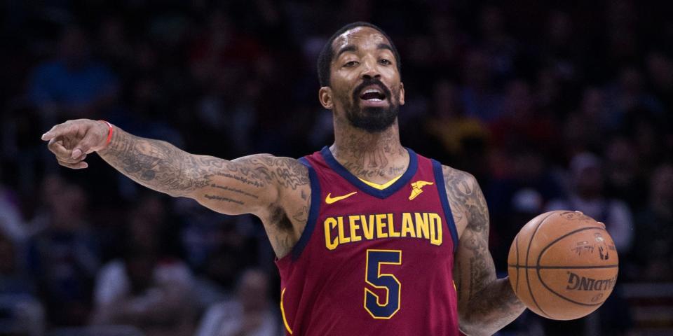 JR Smith points while dribbling the basketball during a game in 2018.