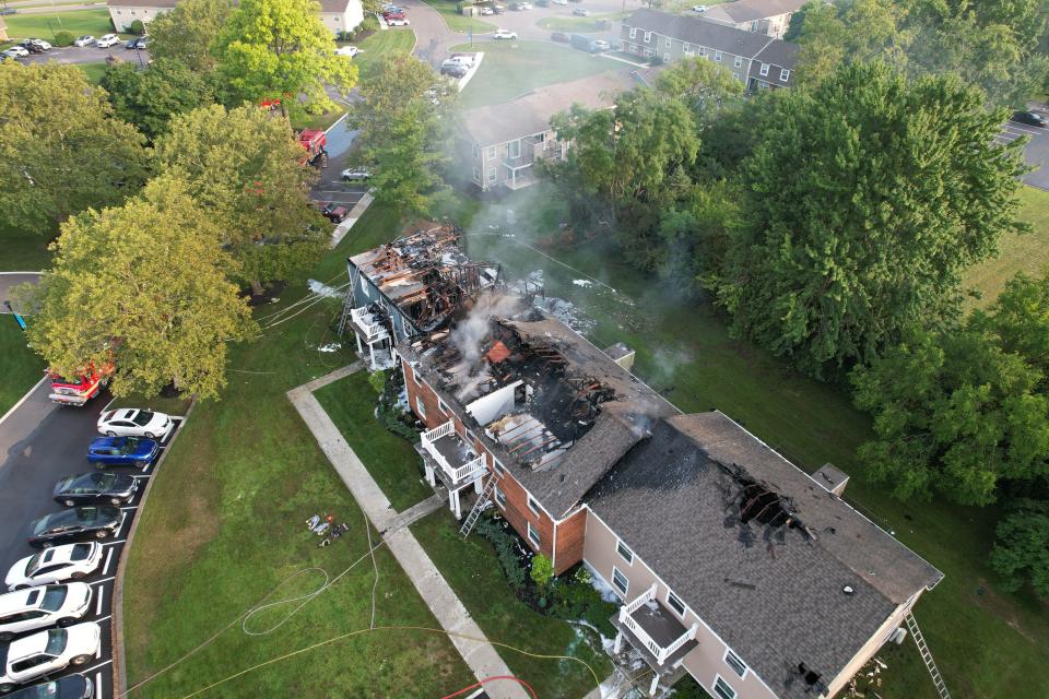 Flames could be seen from the roof of an apartment fire in Washington Township early Thursday morning.