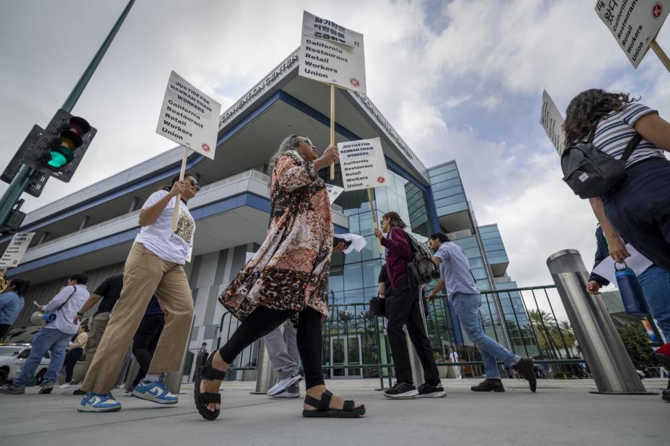 A coalition of community-based organizations protests for wage rights at the Anaheim Convention Center.