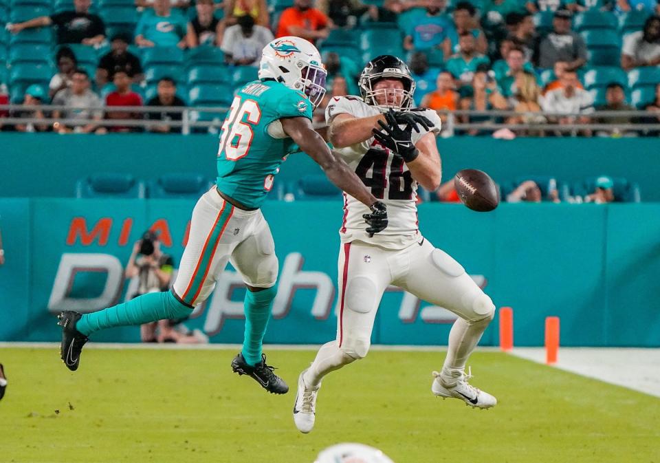 Miami Dolphins safety Keidron Smith (36) breaks up a pass intended for Atlanta Falcons tight end Parker Hesse (46) during the fourth quarter of a preseason game at Hard Rock Stadium on Friday, August 11, 2023, in Miami Gardens, FL.