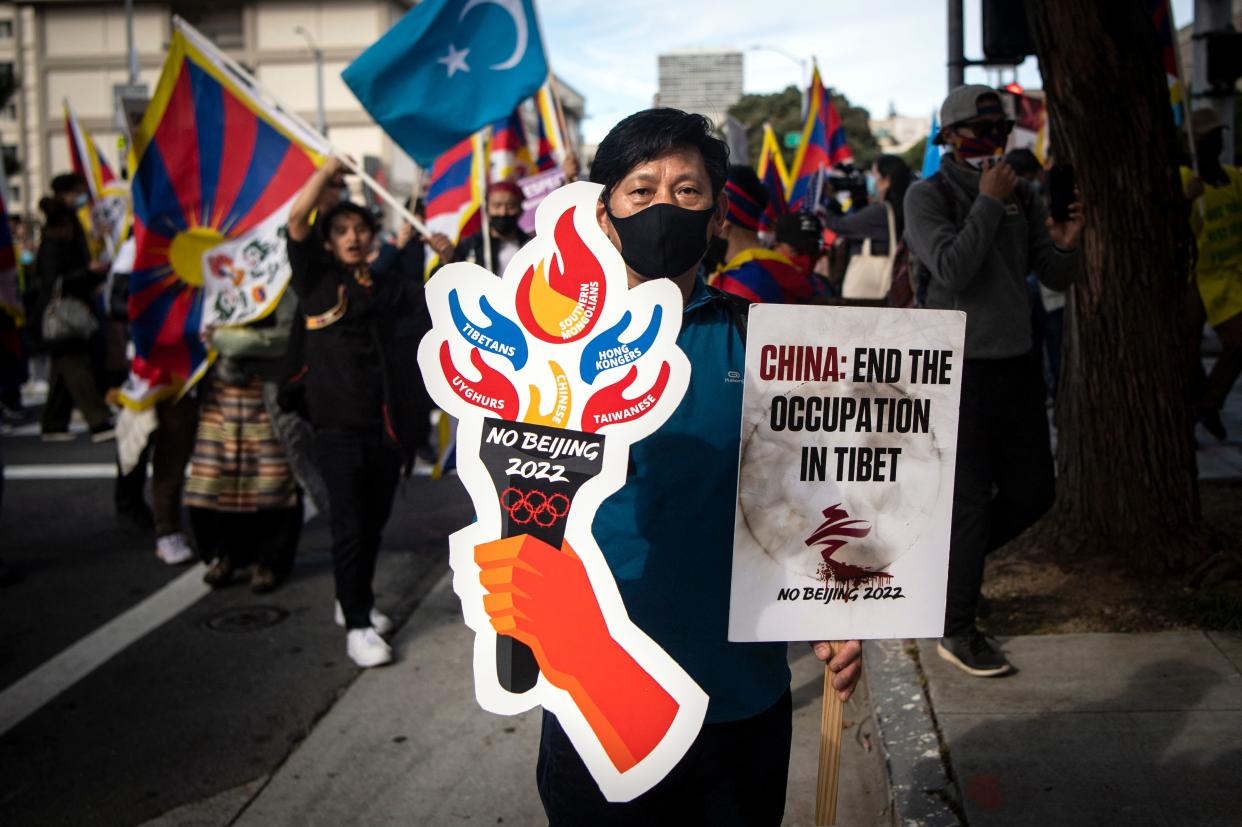 A protester holds up a sign outside the Consulate General of the People's Republic of China in San Francisco, California during a demonstration against the 2022 Winter Olympic Games on February 3, 2022. (JOSH EDELSON/AFP via Getty Images)
