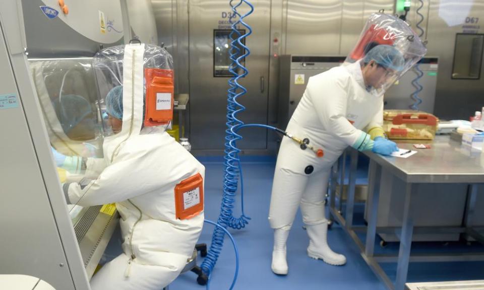 An image issued on 16 April 2020 of researchers working in a lab at the Wuhan Institute of Virology in February 2017