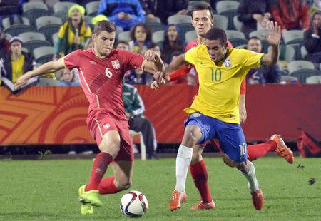 Brazil's Gabriel Jesus (R) is tackled by Serbia's Nemanja Maksimovic and Srdan Babic (L) during their U20 Soccer World Cup final match in Auckland, New Zealand, June 20, 2015. REUTERS/Carlos Sarraf