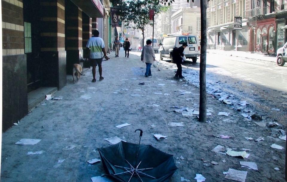 Mr Hill pictured walking his dog outside his apartment the day after 9/11 (Fred Hill)