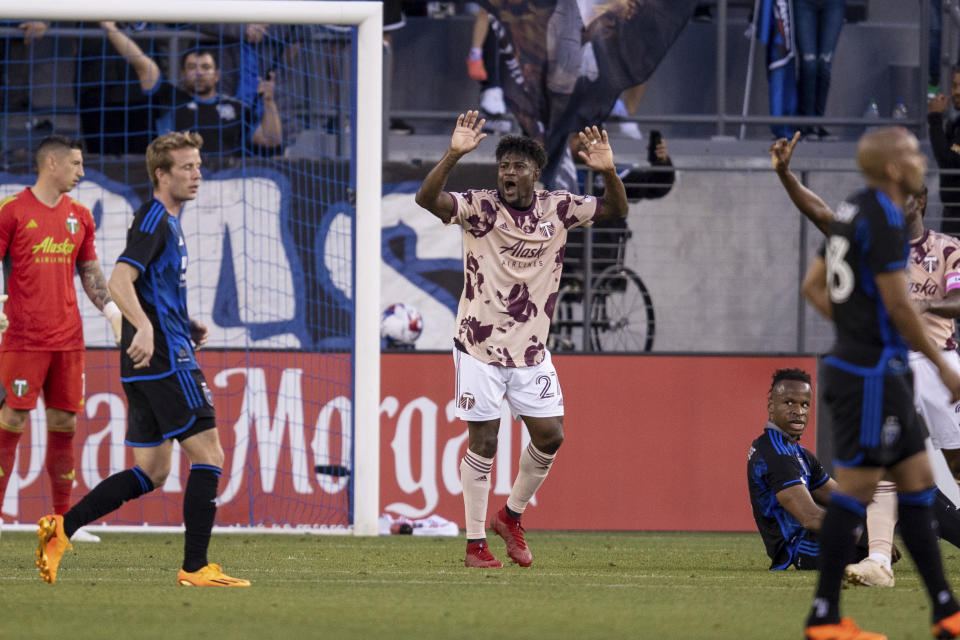 Portland Timbers midfielder Dairon Asprilla, center, reacts after a free kick was given to San Jose Earthquakes midfielder Carlos Gruezo (not shown) during the first half of an MLS soccer match in San Jose, Calif., Saturday, June 17, 2023. (AP Photo/John Hefti)