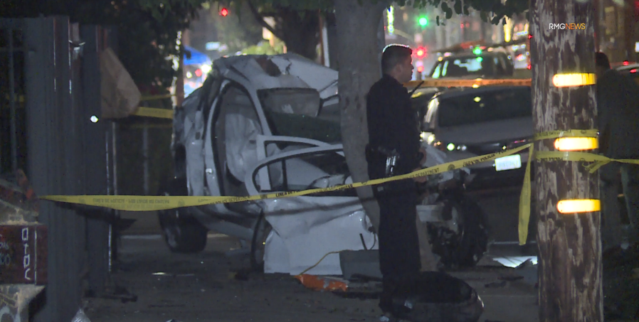 Sometime during the pursuit, the victim rammed his SUV into the suspects’ sedan, causing it to lose control and smash into a light pole at the corner of Adams Boulevard and West View Street. June 29, 2024. (RMGNews)