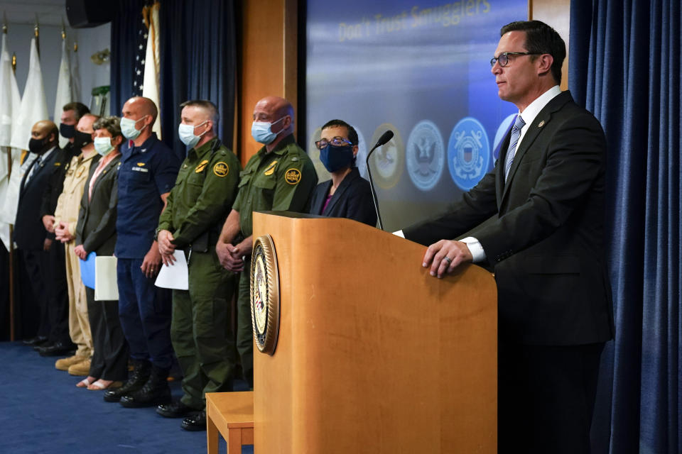 Acting United States Attorney Randy Grossman, right, speaks alongside area federal law enforcement officials Wednesday, June 2, 2021, in San Diego. The officials called for migrants contemplating crossing the border illegally to be aware of the dangers, after a wave of smuggling deaths in the region. (AP Photo/Gregory Bull)