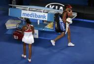 Serbia's Ana Ivanovic (R) wipes her eyes as she walks past Madison Keys of the U.S. after Keys won their third round match at the Australian Open tennis tournament at Melbourne Park, Australia, January 23, 2016. REUTERS/Jason Reed