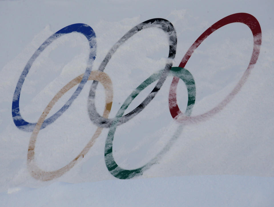 Olympic rings are covered with fresh snow at the Phoenix Snow Park in PyeongChang, South Korea. (AP)