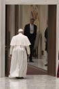 Pope Francis leaves at the end of his weekly general audience in the Paul VI Hall at the Vatican, Wednesday, Oct. 28, 2020. Pope Francis has blamed “this lady COVID” for forcing him to keep his distance from the faithful during his general audience, which was far smaller than usual amid soaring coronavirus infections in Italy. (AP Photo/Alessandra Tarantino)