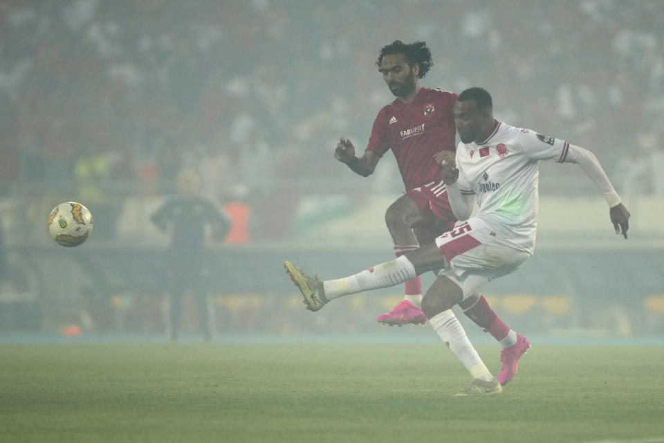 Wydad's Amine Farhane, right, kicks the ball ahead of Al Ahly's Hussein Aly Elshahat during the CAF Champions League Soccer final soccer match between Morocco's Wydad Athletic Club and Egypt's Al Ahly SC, at the Mohammed V stadium, in Casablanca, Morocco, Sunday, June 11, 2023. (AP Photo/Mosa'ab Elshamy)