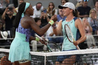 Coco Gauff of the U.S., left, congratulates Poland's Iga Swiatek who won the final in two sets, 6-1, 6-3, at the French Open tennis tournament in Roland Garros stadium in Paris, France, Saturday, June 4, 2022. (AP Photo/Michel Euler)