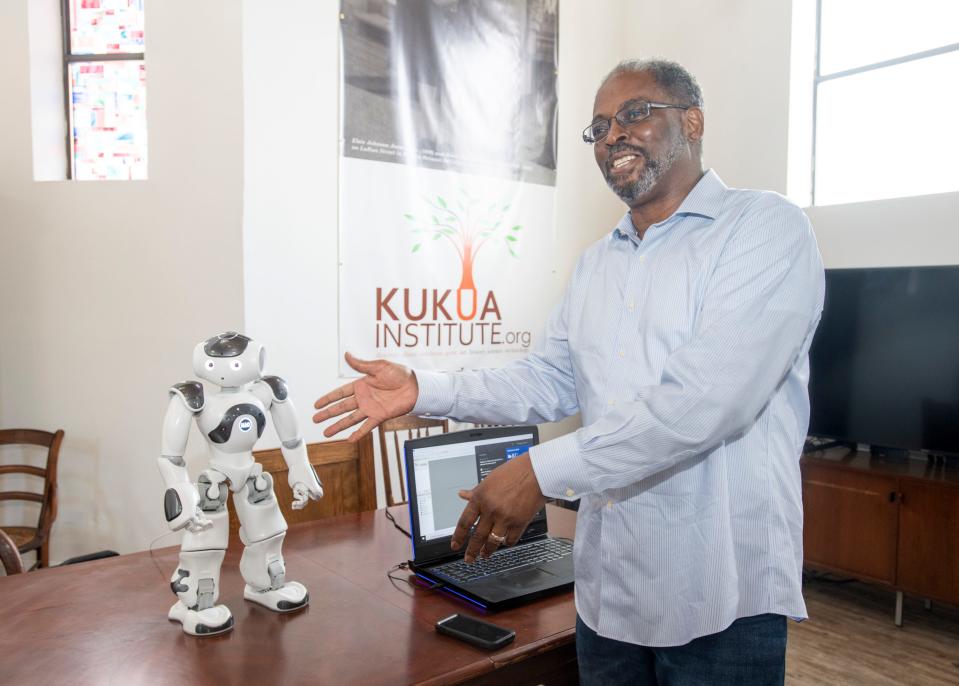 Co-founder Lloyd Reshard talks about the robot called C.H.A.R.L.I.E., which stands for connecting history and robotics learning innovation education, at the Kukua Institute in the historic Belmont-DeVilliers neighborhood of downtown Pensacola on Wednesday, June 23, 2021.  The institute will be offering a summer program for children to learn history through some of the most advanced technologies.