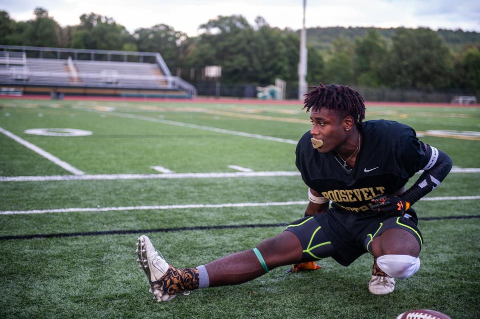 Khamani Hunter stretches during football practice at FDR High School in Staatsburg, NY on Wednesday, August 24, 2022. KELLY MARSH/FOR THE POUGHKEEPSIE JOURNAL