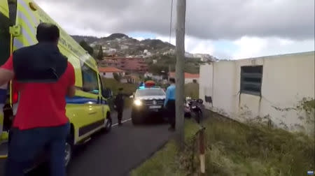 Emergency responders are seen at the site of a bus accident in Canico, in the Portuguese Island of Madeira, April 17, 2019 in this still image taken from social media video. Courtesy DIARIO de Noticias da Madeira/via REUTERS