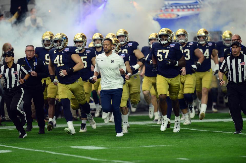 Coach Marcus Freeman and Notre Dame will open the season at Ohio State on Sept. 3.