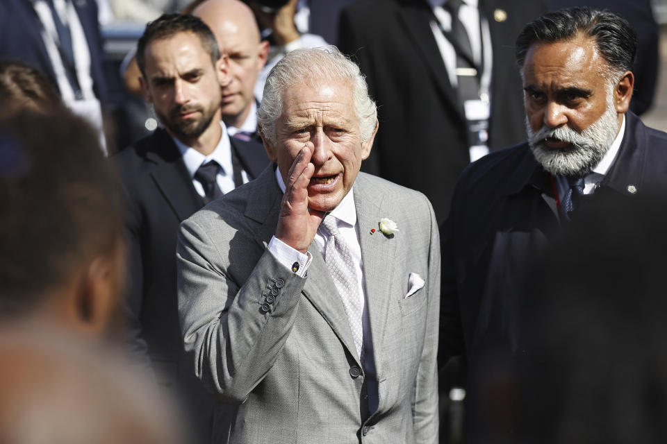 Britain's King Charles III speaks to members of a crowd gathered at Place de la Bourse in Bordeaux, southwestern France, Friday Sept. 22, 2023. After pageantry and politics in Paris, King Charles III concluded his three-day state visit to France with a trip down south to Bordeaux on Friday to focus on a more personal passion: the environment. (Sebastien Ortola, Pool via AP)