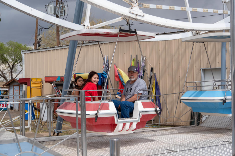 A family enjoys the Wonder Wheel at the Wonderland Amusement Park in Amarillo in this April 2023 file photo. The park opens for the season on Saturday, offering a holiday getaway over Easter weekend.