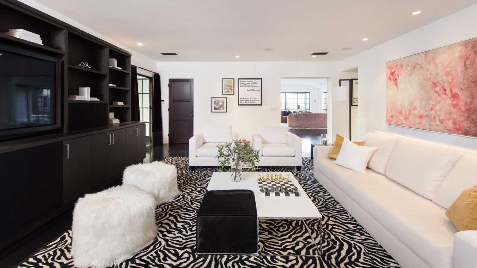 <p>Obviously, no Hollywood home is complete without a suitable space to consume media, and this contemporary room offers a built-in media cabinet. </p>