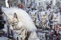 <p>Masked Guggen music bands, brass and percussion carnival bands, parade through the streets on the occasion of the start of the street carnival in Lucerne, Switzerland, Feb. 23, 2017. (Photo: Urs Flueeler/Keystone via AP) </p>