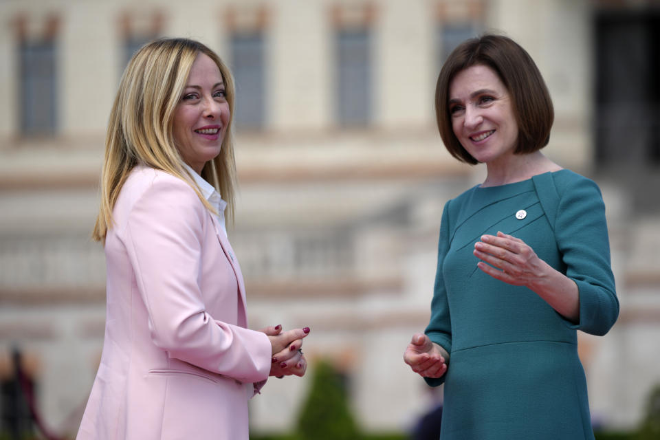 Moldova's President Maia Sandu, right, greets Italy's Prime Minister Giorgia Meloni during arrivals for the European Political Community Summit at the Mimi Castle in Bulboaca, Moldova, Thursday, June 1, 2023. Leaders are meeting in Moldova Thursday for a summit aiming to show a united front in the face of Russia's war in Ukraine and underscore support for the Eastern European country's ambitions to draw closer to the West and keep Moscow at bay. (AP Photo/Andreea Alexandru)