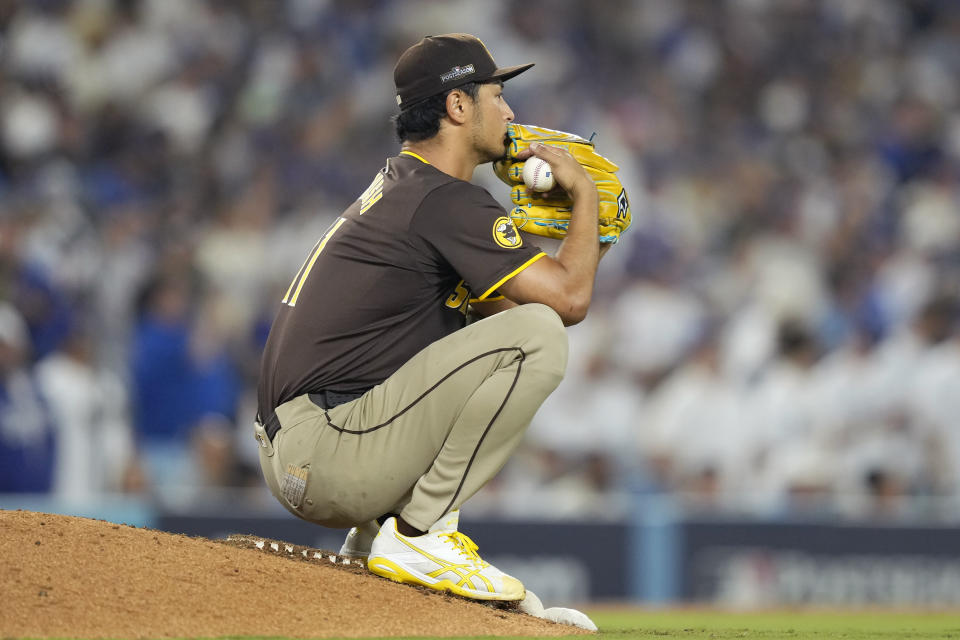 San Diego Padres pitcher Yu Darvish pauses on the mound during the seventh inning in Game 2 of a baseball NL Division Series against the Los Angeles Dodgers, Sunday, Oct. 6, 2024, in Los Angeles. (AP Photo/Mark J. Terrill)