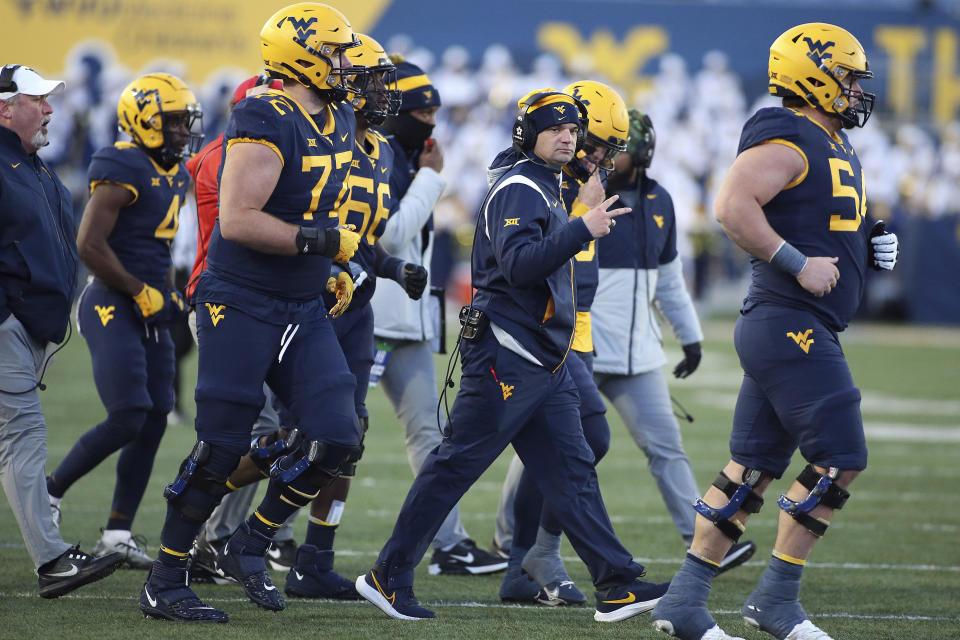 West Virginia coach Neal Brown signals during a time out during the second half of an NCAA college football game against Kansas State in Morgantown, W.Va., Saturday, Nov. 19, 2022. (AP Photo/Kathleen Batten)