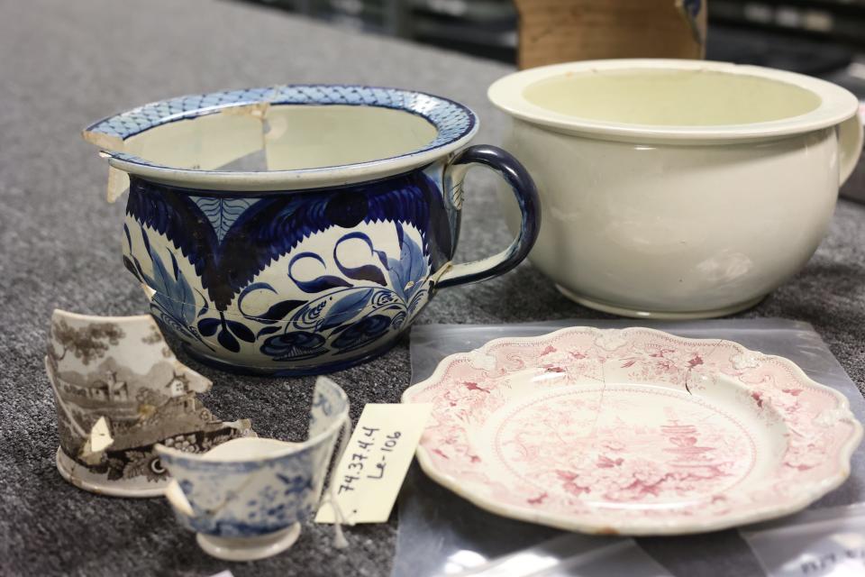 Two commodes, cups and a plate recovered from the Washington Hall Hotel fire of 1843 and housed at the Florida Department of State, Bureau of Archaeological Research Collections.