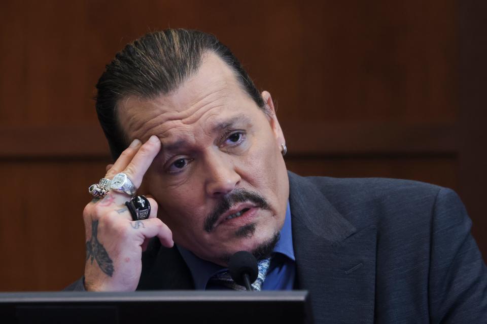 Johnny Depp testifies in the courtroom in the Fairfax County Circuit Courthouse in Fairfax, Va., Wednesday, May 25, 2022.