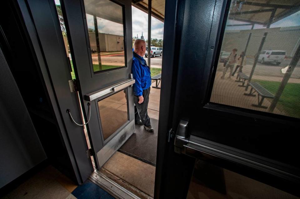 Lipan ISD Superintendent Ralph Carter holds the doors for students after the lunch break Friday, March 24, 2023.